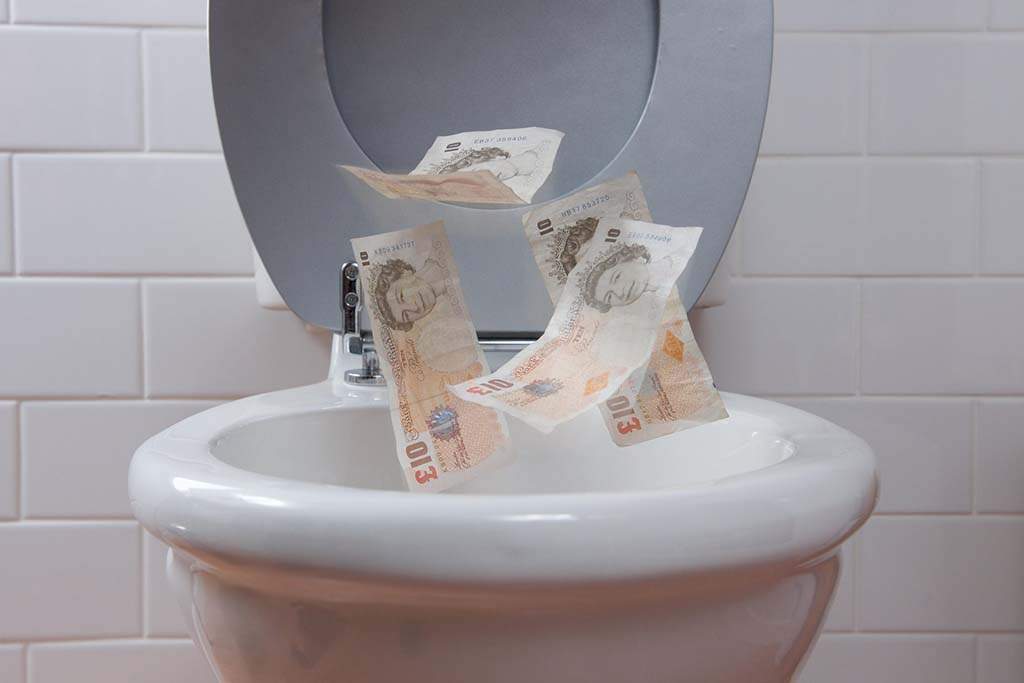 ten pound notes floating down the toilet