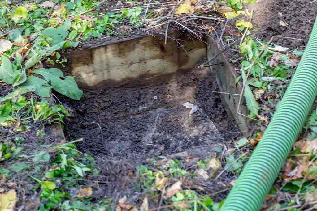 concealed septic tank in garden