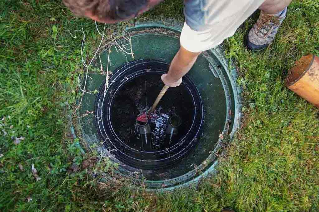 inspecting a septic tank